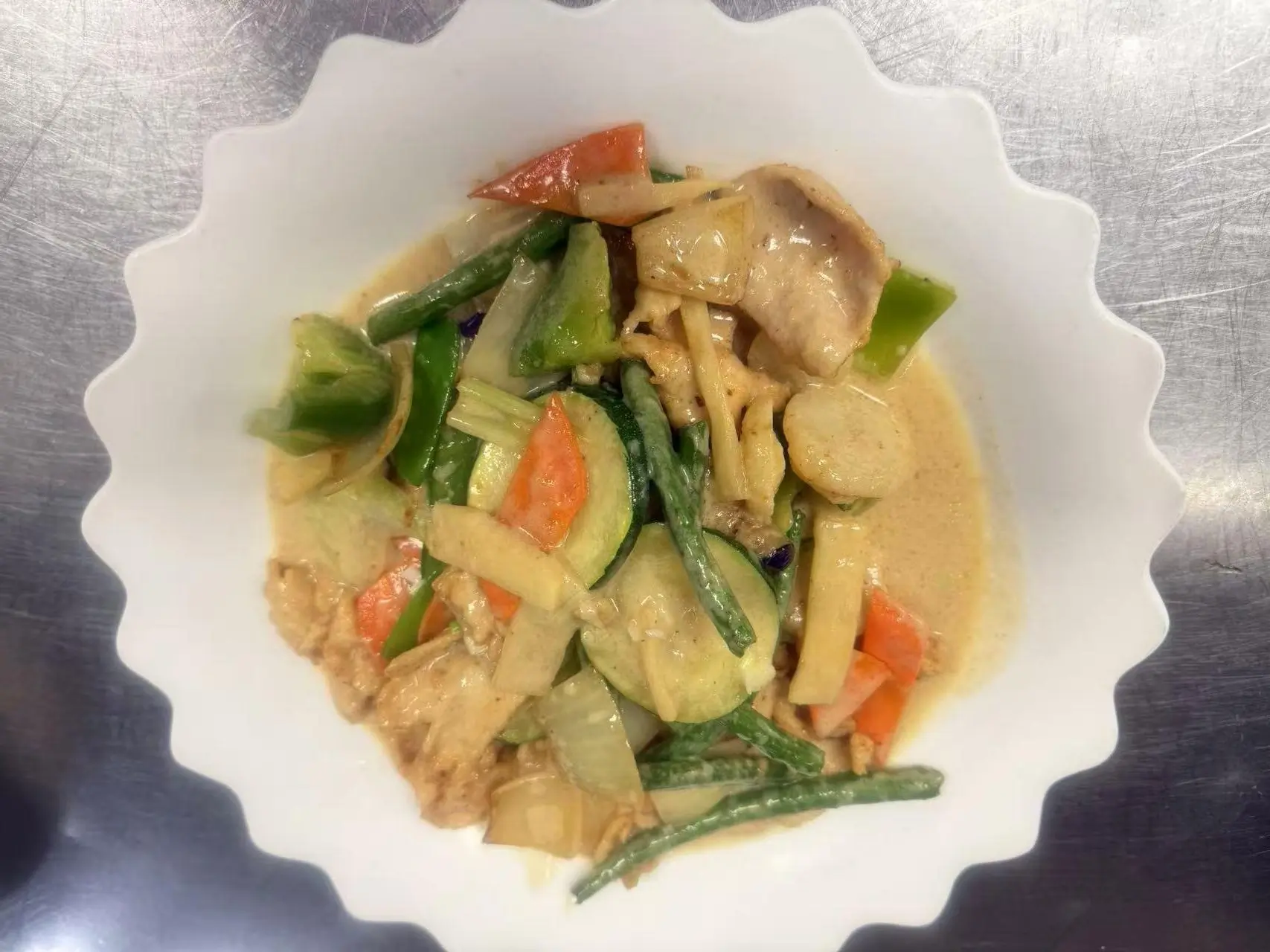 China-Panda-Chinese-restaurant-Yellow-Chicken-Thai-Curry-Athens Yellow Chicken Thai Curry presents chicken and vegetables like green beans, zucchini and carrots, cooked in a yellow curry sauce at China Panda, a Asian Cuisine restaurant in Athens