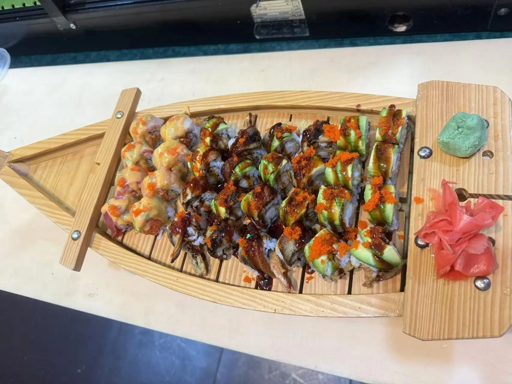 China-Panda-Japanese-restaurant-Sushi-Boat-Athens Sushi Boat features a variety of sushi rolls, neatly arranged on a wooden boat - shaped platter, accompanied by pickled ginger and wasabi at China Panda, a Asian Cuisine restaurant in Athens