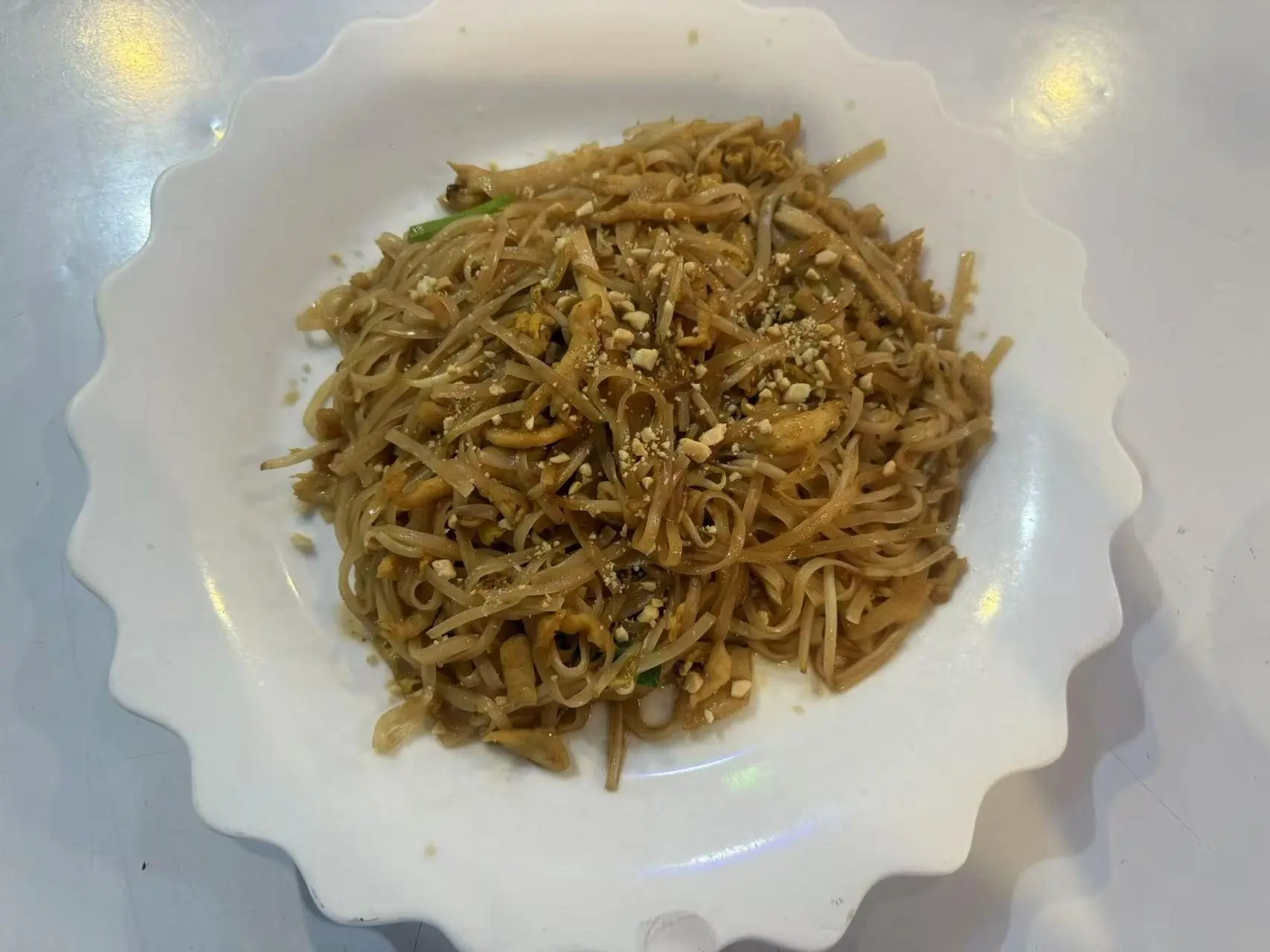 China-Panda-Chinese-restaurant-Chicken-Pad-Thai-Athens Chicken-Pad-Thai is stir-fried rice noodles with vegetables and chicken, topped with crushed peanuts at China Panda, a Asian restaurant in Athens